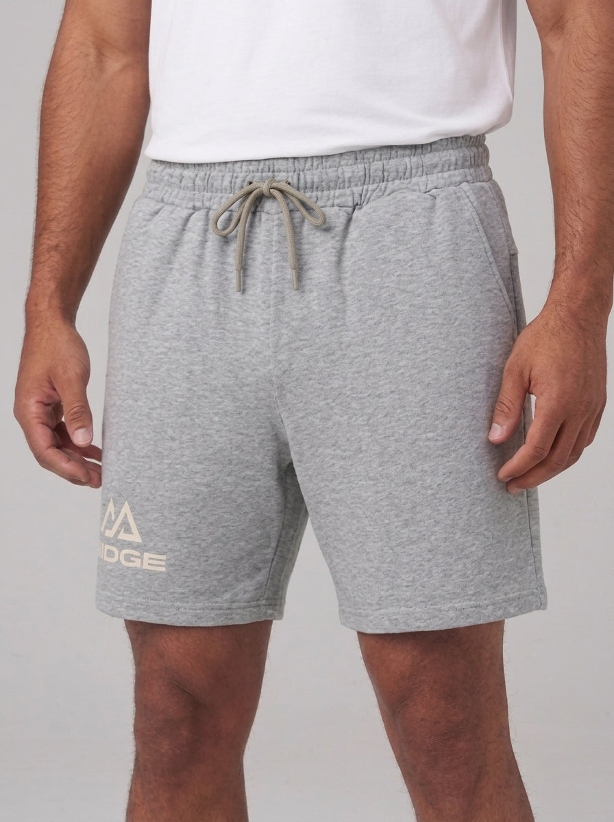 Flower Gray RIDGE Training Short, front view showing the drawcord waistband, side seam pockets and the RIDGE lockup at the thigh